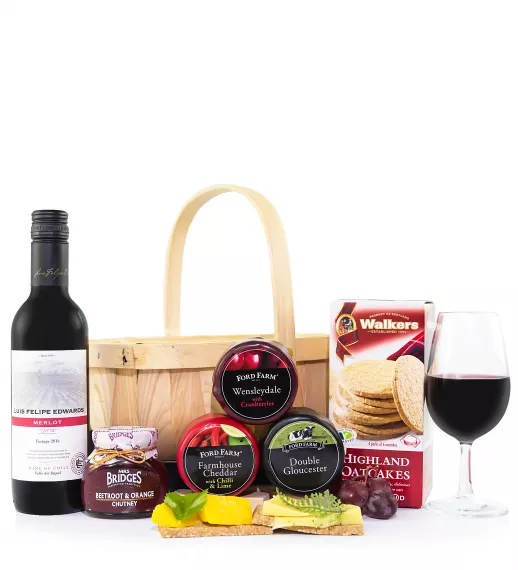 Gifts - Cheese and Wine Basket, £44.99 - We have put together these delicious waxed cheeses in a country basket to make a fabulous celebratory feast.