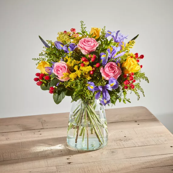 flowers - Distant Embrace, £38.00 - Our 'Distant Embrace' bouquet is a symphony of pink and yellow dancing through pops of red and purple.
