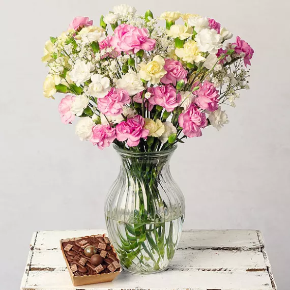 flowers - Cascade Cake Gift, £24.00 - A pretty bouquet of delicate spray Carnations in colorful shades delivered with a miniature chocolate cake.