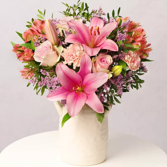 flowers - Strawberry Sunset, £29.25 - An enchanting assortment of romantic pink Roses, blush Carnations, and a show-stopping strawberry pink Lily.