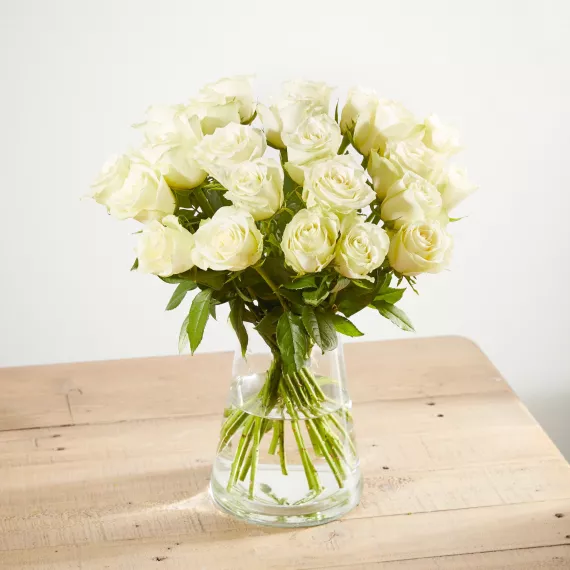 Flowers - 24 Fairtrade White Roses, £40.00 - This hand-tied Fairtrade bouquet of 24 pure white roses from Arena Flowers is a classic choice, embodying purity and elegance.