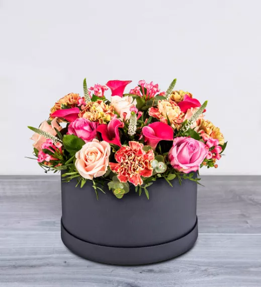 flowers - Enchanted Elegance Hatbox, £89.99 - Introducing our Enchanted Elegance Hatbox, a beautiful luxury flower gift with elegant pink hues, beautifully handcrafted by our florists to create a symphony of color.