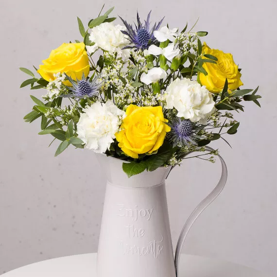 letterbox - Sweet Sunshine Letterbox, £25.50 - Cheerful yellow Roses, soft cream Carnations, and eclectic blue Thistles fill a bouquet that captures the warmth and beauty of a spring day.