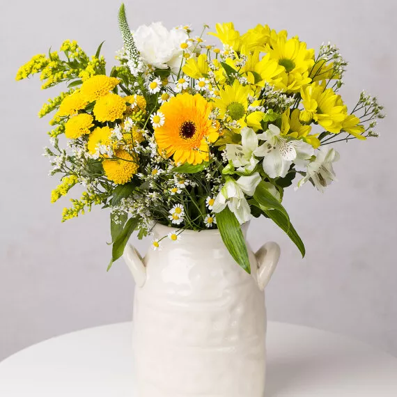 flowers - Honey Drizzle, £25.95 - The Honey Drizzle bouquet features a beautiful variety of yellow and white spring blooms that radiate warmth and happiness.