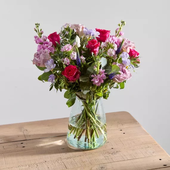 flowers - Fuchsia Allure, £45.00 - This beauty captivates and charms thanks to hot cerise roses surrounded by bewitching blooms in pink and lilac.