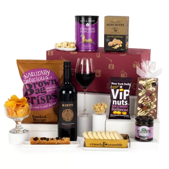 hampers - The Box of Indulgence, £40.45 - This beautiful food and red wine hamper includes all the sweet and savory treats that a family, couple, or team could need to make a celebration special.