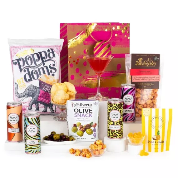 hampers - Cocktail Lovers Gift, £35.25 - Your ticket to an evening of indulgence, this hamper features sweet treats like Joe & Seph's Cosmopolitan Gourmet Popcorn, savory Mr Filbert's Rosemary & Garlic Olives, and four Shake Baby Shake ready-to-drink cocktails.