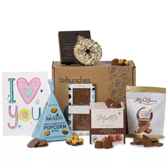 hampers - Love is Sweet, £30.95 - A hamper for that special someone packed with sweet treats including cocoa truffles, milk chocolate popcorn bites, and a salted caramel crunch slab.