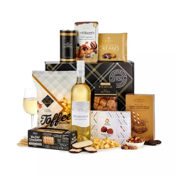 hampers - The Nutcracker With White Wine, £43.97 - This hamper is full of festive treats, including a box of Belgian chocolate truffles, salted caramel creams, and finished with a 75cl bottle of Waters Edge Sauvignon Blanc.