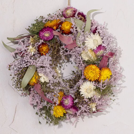 gifts - Floral Fields Dried Wreath, £36.00 - This beautiful wreath of gentle pastel dried wildflowers with bursts of bright orange will create a stunning centerpiece for any home.
