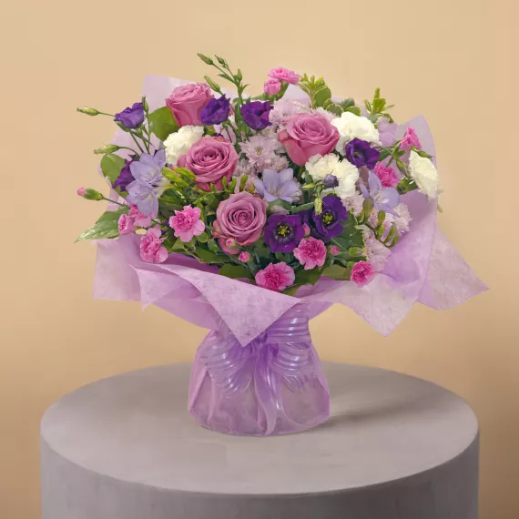 flowers - New Princess, £44.99 - Fit for royalty, our exquisite New Princess bouquet features a delicate blend of pink, cream, and purple flowers, beautifully accented with seasonal foliage.