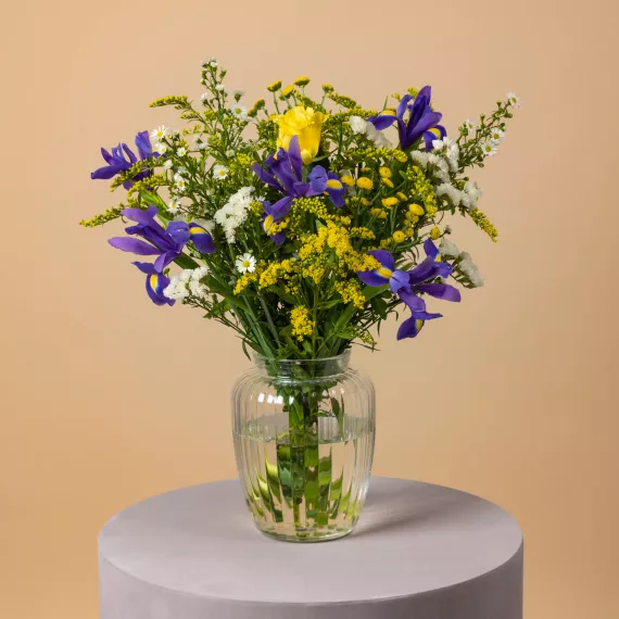 letterbox - Sunshine Happiness, £29.99 - Teeming with Iris, Statice, September flowers, Solidago, and a show-stopping Rose, this bouquet evokes the joy of wandering through a fragrant meadow on a bright summer's day.