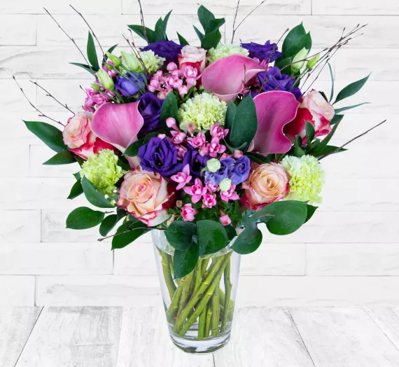 flowers - Wild and Beautiful, £44.99 - Our artisan florists have meticulously crafted this beautiful bouquet using the finest stems of Pink Calla Lilies, Sweetness Roses, Green Carnations, Pink Bouvardia, Purple Lisianthus, Ruscus, and natural Birch.