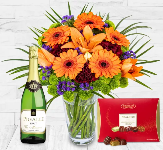 Gifts - Joyous Charm Deluxe Gift, £54.99 - A glorious celebration of beautiful Lily La Orange Flowers, Blue Statice, Germinis, Carnations, and Chrysanthemums.