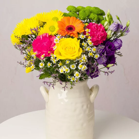 flowers - Summer Brights, £26.75 - A beautiful yellow Rose is surrounded by colorful Carnations, bright Germini, and cheerful Chrysanthemums, all complemented by rich purple Lisianthus.