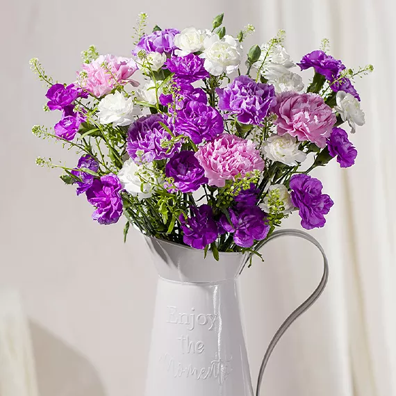 flowers - Lavender Charm, £29.50 - This charming collection of Carnations in pink and purple hues accented with white Spray Carnations will undoubtedly bring a smile to anyone’s face.