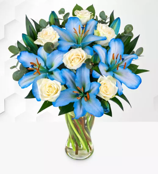 flowers - Ocean Lily and Rose Bouquet, £34.99 - Make any occasion unforgettable with this captivating blue and white flower arrangement.